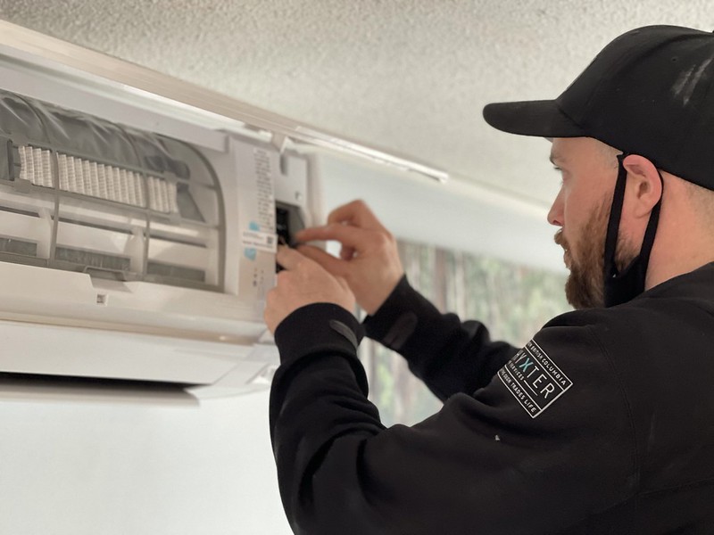 Wall-mounted ductless mini-split head installed in a Phoenix home