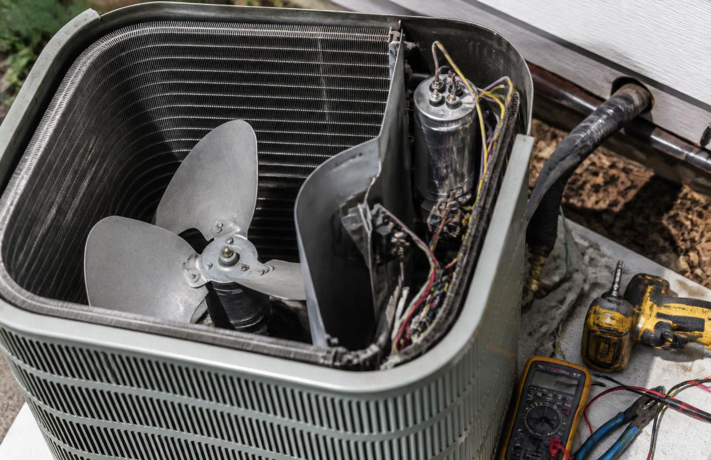 Residential air conditioning condenser being diagnosed for a cooling problem in Arizona